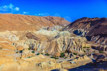 Ancient mountains in the valley of the Dead Sea. Picturesque multicolored sandstone dry talus