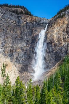 Rocky Mountains of Canada. Yoho National Park. Autumn Takakkaw Falls full-flowing waterfall