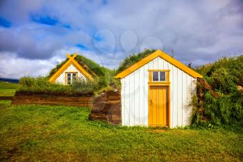 The picturesque village of old houses covered with turf and grass. Glaumbaer, Iceland. The concept of the ethnographic and historical tourism