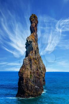 Concept of exotic and ecological tourism. Two huge scenic rocks near the pebble beach. Trip to the fabulous island of Madeira in the Atlantic Ocean