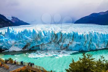 Grandiose glacier Perito Moreno in the Patagonia. Argentine province of Santa Cruz. The world's third largest fresh water reserve. The concept of active and extreme tourism