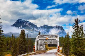 Bridge over the river in the picturesque mountain reserve.  Canadian Rocky Mountains, Jasper National Park