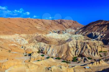  Picturesque multicolored sandstone dry talus. Ancient mountains in the valley of the Dead Sea