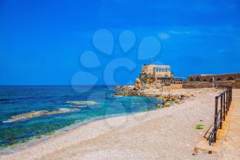 The restored castle on the sea spit. National park Caesarea on the Mediterranean. Israel