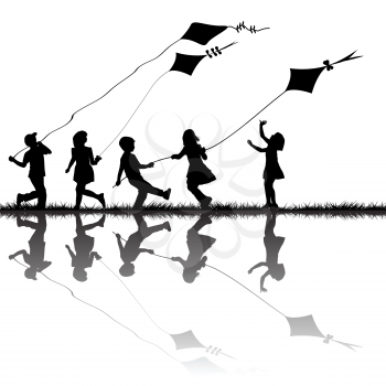 Children silhouettes playing with kites flying outdoor