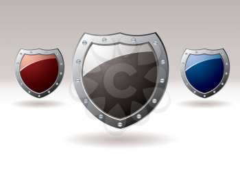 Collection of three metal shields with colored centers for text