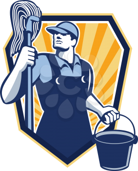 Illustration of a janitor cleaner worker holding mop and water bucket pail viewed from low angle done in retro style set inside shield crest.