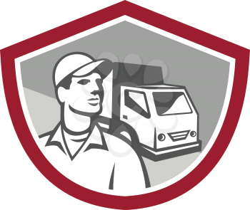 Illustration of a removal man delivery guy with moving truck van in the background set inside shield on isolated background done in retro style.