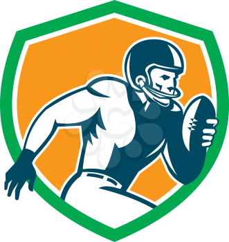 Illustration of an american football gridiron player holding ball running rushing viewed from the side set inside shield crest on isolated background done in retro style. 