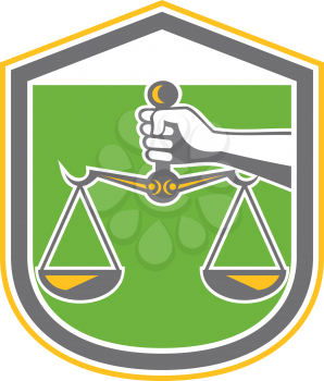 Illustration of a hand holding scales of justice set inside shield crest done in retro style.