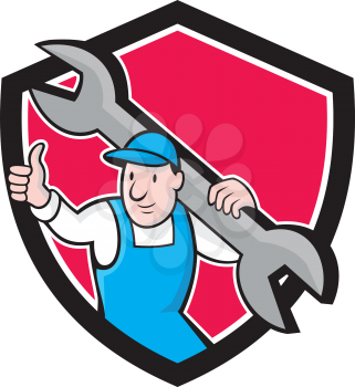 Illustration of a plumber in overalls and hat thumbs up holding monkey wrench set inside shield crest on isolated background done in cartoon style.
