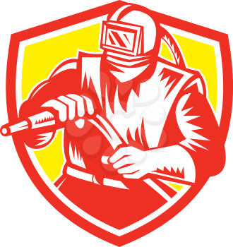 Illustration of a sandblaster worker holding sandblasting hose wearing helmet visor set inside shield crest on isolated background done in retro style.