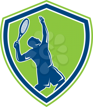 Illustration of a silhouette tennis player holding racquet serving set inside shield crest on isolated background done in retro style. 