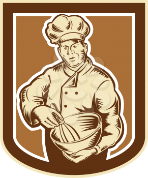 Illustration of a baker chef cook holding a mixing bowl viewed from front set inside shield crest done in retro woodcut style on isolated background.