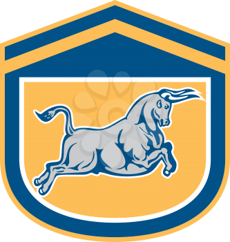 Illustration of a bull attacking charging viewed from the side set inside shield, crest on isolated background done in retro style.