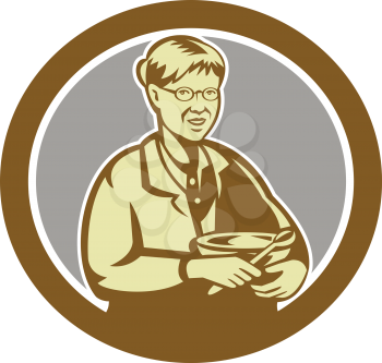 Illustration of granny chef, cook or baker holding mixing bowl set inside oval shape on isolated background done in retro style.