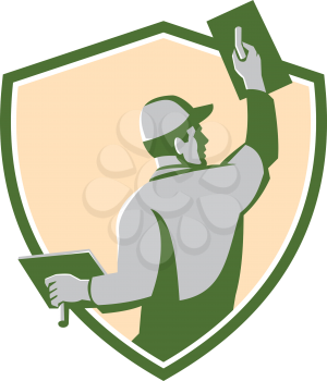 Illustration of a plasterer masonry tradesman construction worker with trowel viewed from the back set inside shield crest done in retro style on isolated background