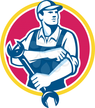 Illustration of a mechanic wearing hat holding spanner wrench rolling sleeve looking to the side set inside circle on isolated background done in retro style.