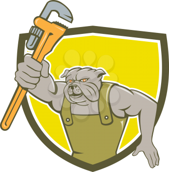 Illustration of a bulldog plumber holding monkey wrench facing front set inside shield crest on isolated background done in cartoon style.