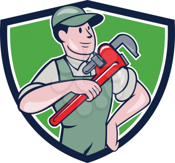 Illustration of a plumber in overalls and hat pointing monkey wrench looking to the side set inside shield crest on isolated background done in cartoon style. 
