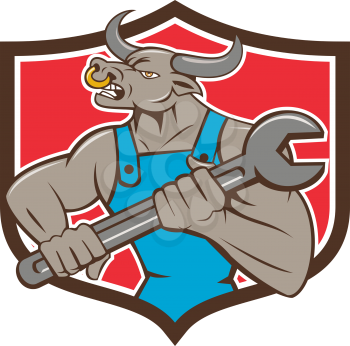 Illustration of a minotaur bull mechanic looking to the side holding giant spanner set inside shield crest on isolated background done in cartoon style. 