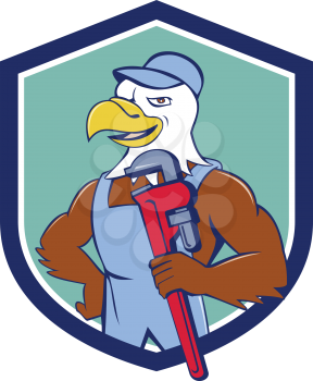 Illustration of an american bald eagle plumber wearing hat holding monkey wrench looking to the side set inside shield crest done in cartoon style. 