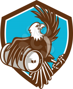 Illustration of an american bald eagle carrying beer keg viewed from the side set inside shield crest on isolated background done in retro style. 