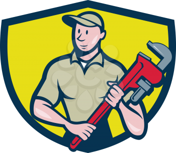 Illustration of a plumber in overalls and hat standing looking to the side holding monkey wrench viewed from front set inside shield crest on isolated background done in cartoon style.