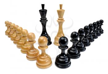 Several wooden chess pieces light and dark colors.