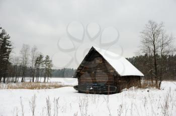 Royalty Free Photo of a Snowy Building in a Field