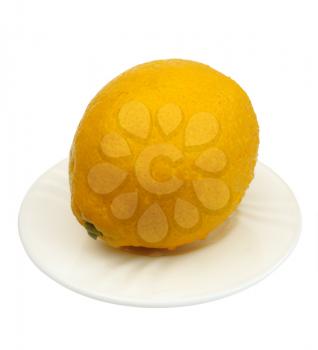 Royalty Free Photo of a Lemon on a White Plate