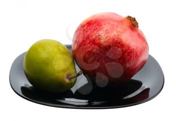 Royalty Free Photo of a Pomegranate and Pear on a Black Plate