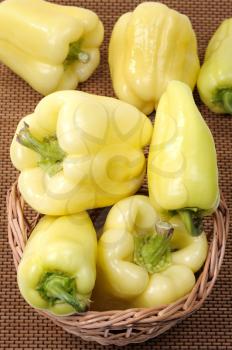 Royalty Free Photo of Yellow Peppers in a Basket