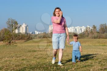 Royalty Free Photo of a Mother and Child Walking in a Park in Ashqelon