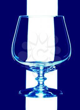 glass goblet, isolated on a blue background.