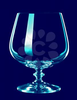 glass goblet, isolated on a blue background.
