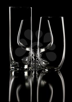 glasses and goblet, isolated on a black background.