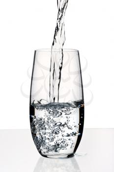 Glass with a water, isolated on a white background.