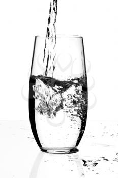 Glass with a water, isolated on a white background.