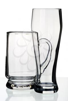 Glass and a mug for beer on a white background, isolated