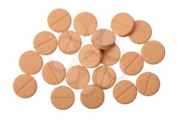 Several beige pills on a white background, isolated