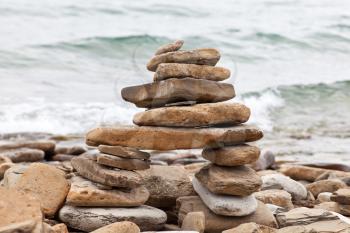 Royalty Free Photo of an Inukshuk on a Lake Huron Shore