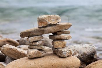 Royalty Free Photo of an Inukshuk on a Lake Huron Shore