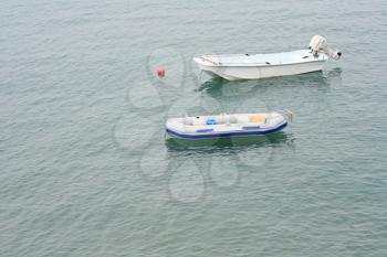 motorboat and inflatable boat in the sea