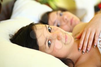 Teenage Girls Lying On the Bed together