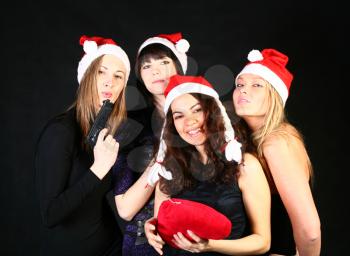 four 20-25 years  women  friends having fun on a christmas party