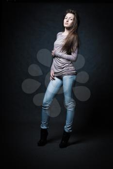 Beautiful Woman Portrait. Sexy Girl in jeans studio shot