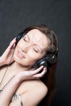 woman with headphones listening to music closed eyes