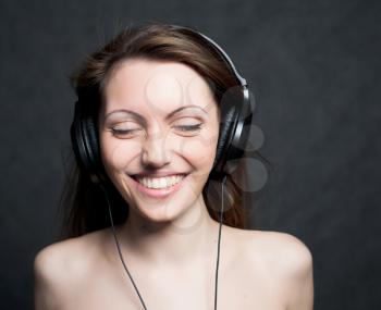 woman with headphones listening to music closed eyes