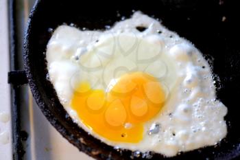 pan full of scramble eggs in a frying pan